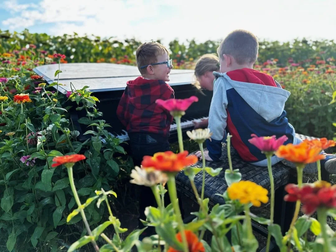 Happy children enjoying farm activities at Brand Farms